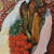 painting of some fish and vegetables on a plate