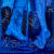 blue monochrome painting of a cowboy boot and a bare foot