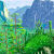 Colorful landscape painting by David Hockney featuring lush green trees and distant blue mountains