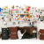 Sage Barnes "Employee Of The Month" installation with drawings on the wall and office desk