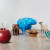 A group of sculptures by claude and francois-xavier lalanne of a large apple, a bronze elephant, a blue hippo, a bronze crab, a concrete sheep and a bronze choupatte