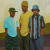 Dennis Brown painting featuring an African American male subjects in hats