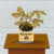 Gabe Langholtz painting of plant inside of Coors beer can on a brown desk