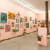 installation view of Lush 2022, gallery with peach walls and floral / plant themed artwork