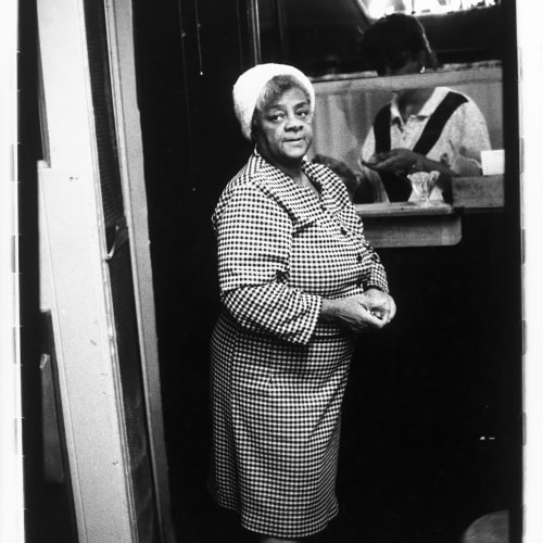 Ming Smith, Checkered Dress Lady Waiting for Order, Pittsburgh, PA, (August Moon Series), 1991