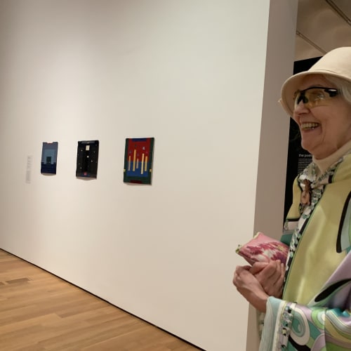 Jana Vander-Lee seen with three of her displayed works at the High Museum for the exhibition's opening.