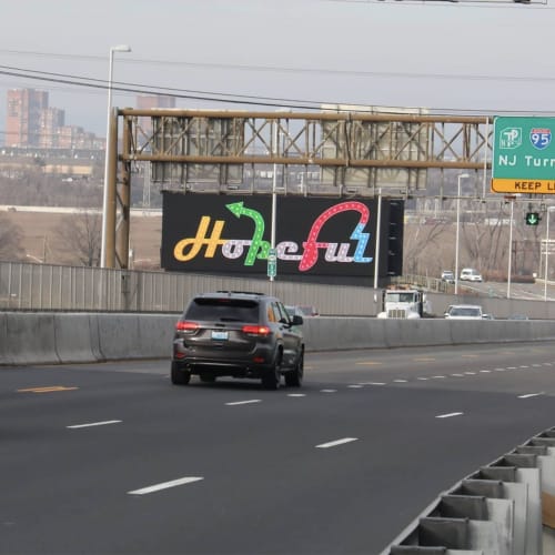 Charlie Hewitt's iconic "Hopeful" sign