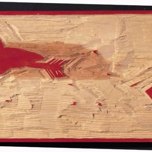 A woodcut sculpture, like a red and white seal