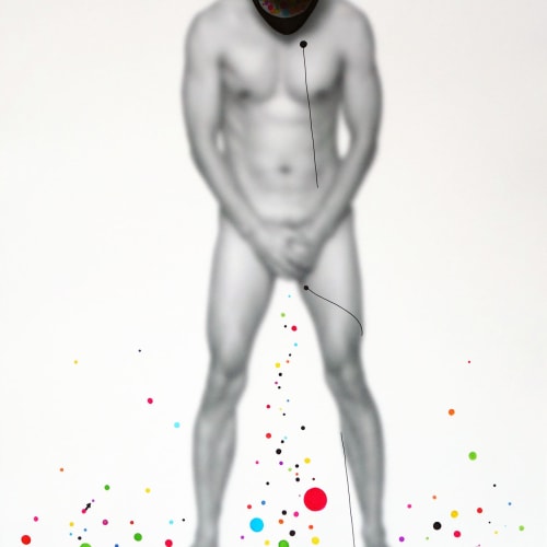 A defocused photo of a man standing nude with his head down and some hand-painted colored dots on the surface