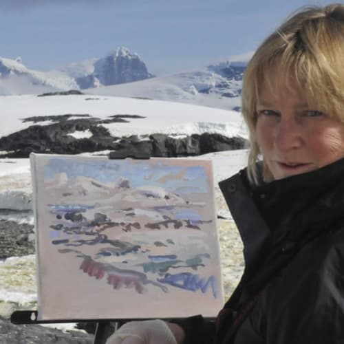 Photo of the artist painting in Antarctica