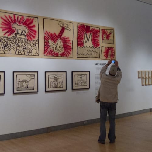 Keith Hearing exhibition at Brooklyn Museum in NYC, Photo: October 4, 2011 "Keith Haring at Brooklyn Museum" by pandemia is licensed under CC BY 2.0.