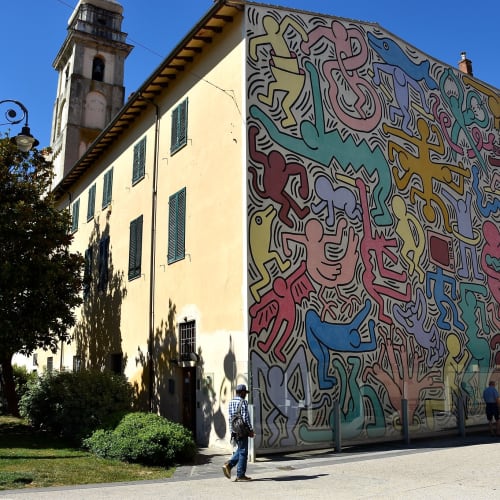 San Antonio Church Pisa 'Tuttomondo' (1988) by American artist Keith Haring Photo by FaceMePLS is licensed under CC BY 2.0. Taken on August 25, 2016