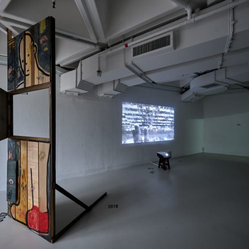 The Present is a Foreign Country (2022) Installation: Single-Channel Video, Acrylics & Charcoal Painting on Plywood, Dimension Variable
