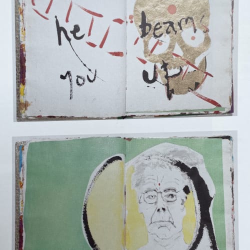 Inside pages of book, one with golden skull and one with self portrait of Max Gimblett