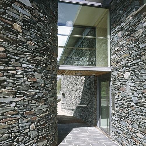 The Entrance to the Jerwood Centre, Wordsworth Trust, Grasmere. Photo: Charlotte Wood. "The Jerwood Centre will hold and hold good. Here and now it is impossible not to sense both its promise and staying power. As a work of architectural art, it represents what the poet W.H. Auden once called ‘The mass and majesty of this world. All / that carries weight and always weighs the same’; but it also represents the ongoingness of what W.B. Yeats called ‘the spiritual intellect’s great work'", Seamus Heaney, Poet Laureate (1939-2013), speaking at the official opening of the Jerwood Centre on 2 June 2005.