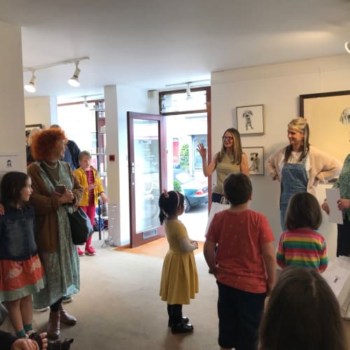 A photograph of Sarah Wiseman Gallery interior, as Sarah Wiseman announces winners of a children's art competition