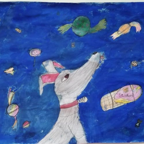 A child's drawing of a dog with a night sky, looking up at floating sweets and candy