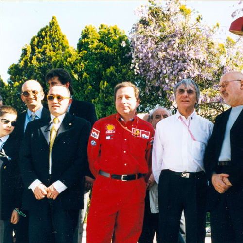 © Maggiore g.a.m. | Franco Calarota, Jean Todt, Bernie Eccleston, Arman, Piero Ferrari and Raffaello de Brasi at the vernissage of Rampante by Arman, Imola, 1999.