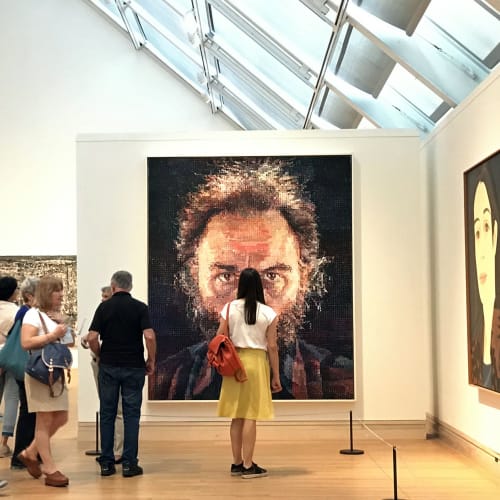 Chuck Close @ The Met New York City, September 2017 Photo by Steam Pipe Trunk Distribution Venue is licensed under CC BY 2.0.