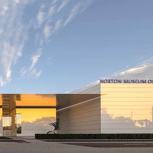 The Norton underwent a renovation, completed in 2019, that expanded the museum’s gallery and teaching space. "Norton Museum of Art front at dusk" by Nortonedits is licensed under CC BY-SA 4.0.