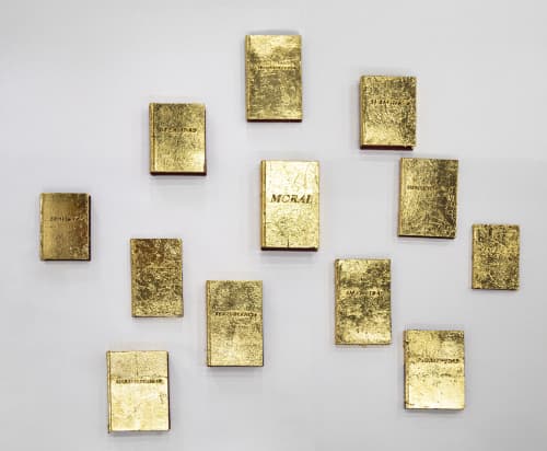 Avelino Sala L'uomo delinquente, 2025 Porcelain, wood, books, gold leaf, and laser cutting. Variable dimensions; 120 x 110 cm. (books); 144 x 44 x 44 cm. (head and base) Edition of 3 plus 1 AP