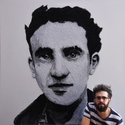 Carlos Alarcon in front of one of his big format works