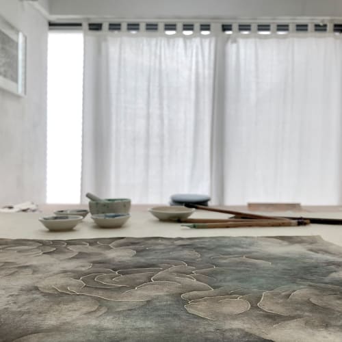 The artist's workbench with an unfinished painting