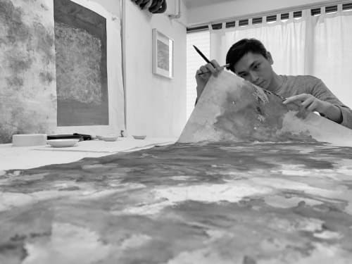 Portrait of Yau Wing Fung working on his painting