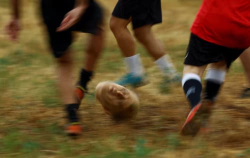 Participants use a reproduction of the head of former Spanish dictator Francisco Franco as a ball, while playing soccer, as part of an artistic performance by Eugenio Merino and North American art collective Indecline, during experimental festival of contemporary creation ExAbrupto in Moia city, north of Barcelona, Spain July 3, 2025. REUTERS/Albert Gea