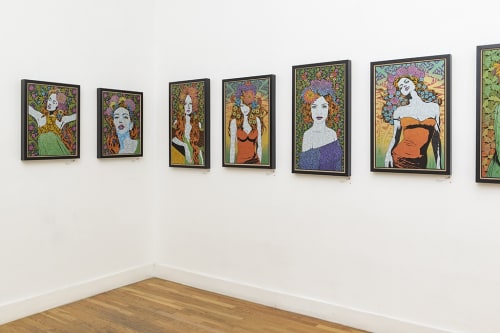 Chuck Sperry prints hung on a wall