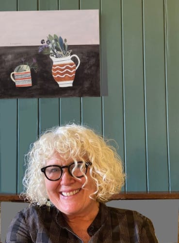 Elaine Pamphilon pictured with one of her paintings