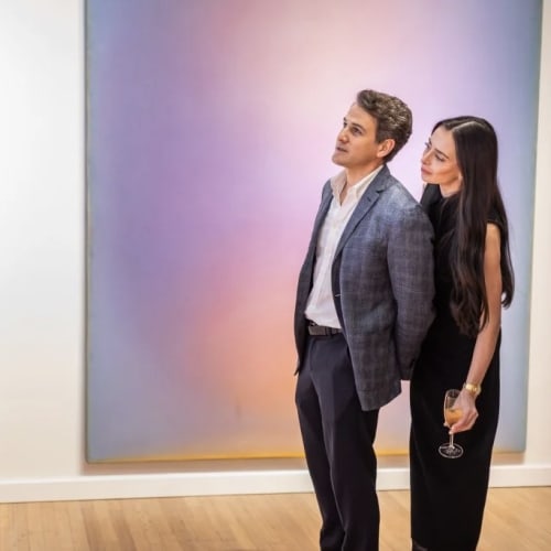 Visitors at the ADAA VIP preview and benefit for Henry Street Settlement enjoying works by Leon Berkowitz at the booth of ACA Galleries, New York. Photo: Scott Rudd.