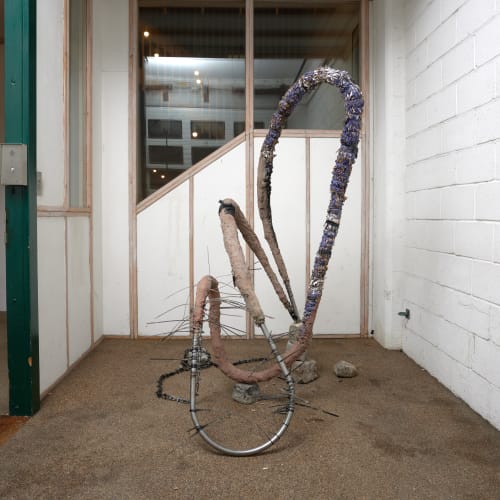 Untitled (Turning Into), steel, GFRC, cardboard, polymer modified gypsum, pigments, cobblestone, cabletie, 190x170x150cm, 2023. Exhibition view in the Weston Studio, Royal Academy of Arts, London