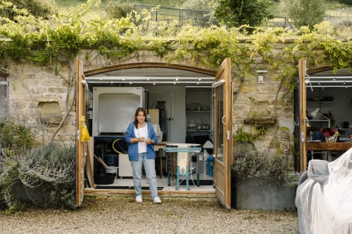 Ceramicist Georgia Loizou outside her studio in a converted barn in Somerset