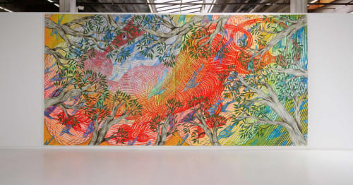 Large mural by Andrew Schoultz depicting a large tiger behind tree line and flying birds in rainbow palette.