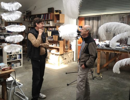 Alan Rath and Peter Lippmann speaking in Rath's studio.
