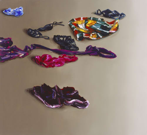 clothes strewn out on beige floor