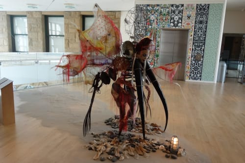 Rina Banerjee, "Viola, from New Orleans-ah, an African Woman, was the 19th century’s rescue worker, a global business goods raker, combed, tilled the land of Commerce, giving America a certain extra extra excess culture, to cultivate it, making home for aliens not registered, made business the finer, finer, had occupations, darning thread not leisure with reason and with luster, in “peek a boo” racial disguises preoccupied in circulating commerce, entertaining white folks, pulling and punching holes in barriers, place that where was once barren, without them, white banks made of mustard and made friendly folks feel home, welcomed and married immigrants from far noted how they been also starved, fled from servitude and colonial dangers, ships like dungeons, posing coal in termite wholes, churning fire, but always learning, folding, washing, welcomed as aliens. She wandering, hosting, raising children, connected to new mobilities and most unusual these movements in Treme’, New Orleans was a incubating, enmeshed embedded in this silken cocoon when she land, she’s came to be parachute mender, landed those black immigrant peddlers from Hoogali network of new comers," 2017, Murano glass horns, Indian rakes, seed beads, steel, Yoruba African mask, oyster shells, cowrie shells, Charlotte dolls, polyester horse hair trim, Korean silks, Indian silks, vintage Kashmir shawls, French wire ferris wheel, Congolese elbow bangles, colonial mirror sconces, Japanese seed glass beads, sequins, threads, dimensions variable