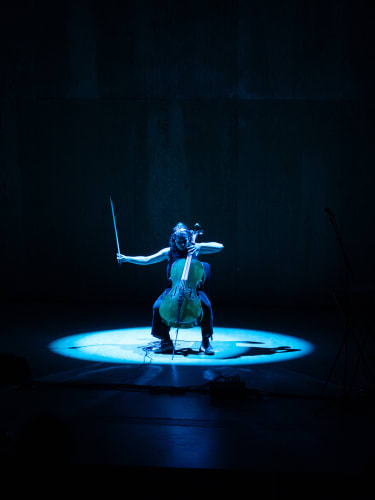 Cellist Stephanie Tress taking part in a performance at the Aldeburgh Festival in June 2024 showcasing work produced on the BPYAP course Composition, Alternative Performance and Performance Art (CAPPA). Photo credit; Marcus Roth.