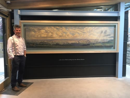 James Lynch at the Somerset Rural Life Museum, Glastonbury, with his commissioned work 'Looking South from Stoke Camp', egg tempera on gesso coated panel, 71 x 304cm (27 x 120ins)