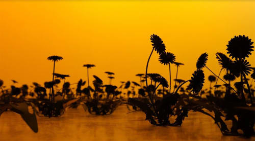 Esmaa Mohamoud, Darkness Doesn’t Rise To The Sun, But We Do, 2022. Steel, paint, acrylic adhesive, orange sunset glow, dimensions variable.