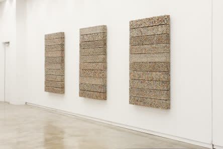 ARTWORK OF THE WEEK: MANISH NAI’S NEWSPAPER WALL AT ART BASEL IN HK
