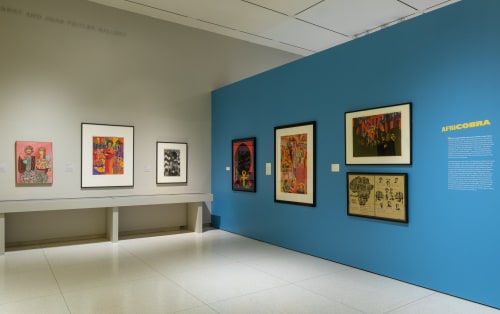 An installation view of the exhibition. Many of the works are by artists who were members of AfriCobra, or the African Commune of Bad Relevant Artists, a group founded in 1968 that sought to reflect the reality of being black in America.Credit...Michael Tropea