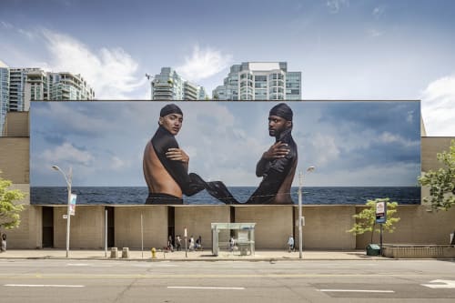 Esmaa Mohamoud's The Brotherhood FUBU (For Us, By Us) stares back at us on Queens Quay.
