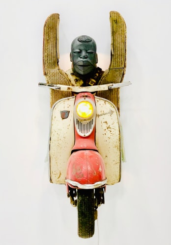 Zak Ové, Hands Up, 2019, 1960s Lambretta scooter, cast graphite, hand made glass African beads, LED lighting and electrical transformer, 140 x 60 x 70 cm