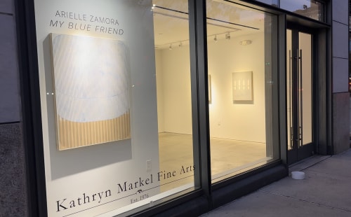 Art gallery window with abstract geometric painting by Arielle Zamora.