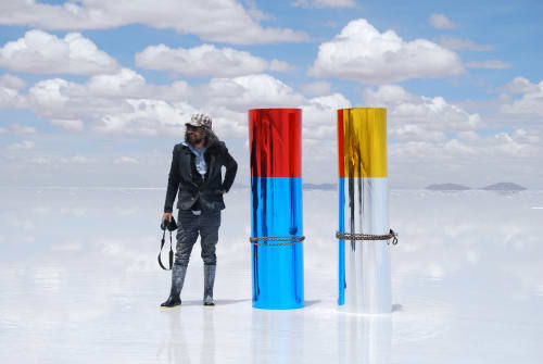 Gaston Uglade artist image, standing beside one of his installations.