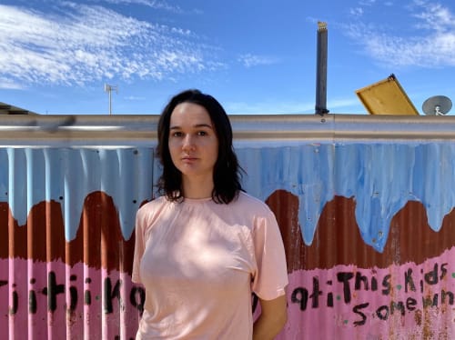 Thea outside the Tangentyere Artist studio in Alice Springs.