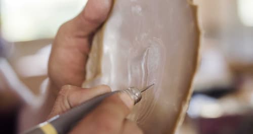 Riji or shell carving/engraving.