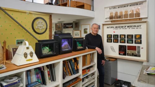 Carl Cheng amid his work, photo by Paul Salveson